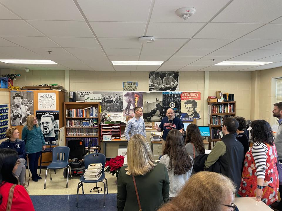 Brookfield East High School social studies teacher Patrick Coffey speaks after being surprised by former students with a $16,500 check and an alumni memory book.