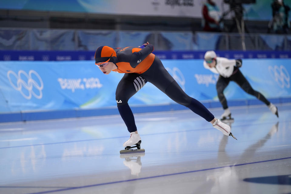 Antoinette de Jong of the Netherlands competes against Ayano Sato of Japan during the women's speedskating 3,000-meter race at the 2022 Winter Olympics, Saturday, Feb. 5, 2022, in Beijing. (AP Photo/Sue Ogrocki)