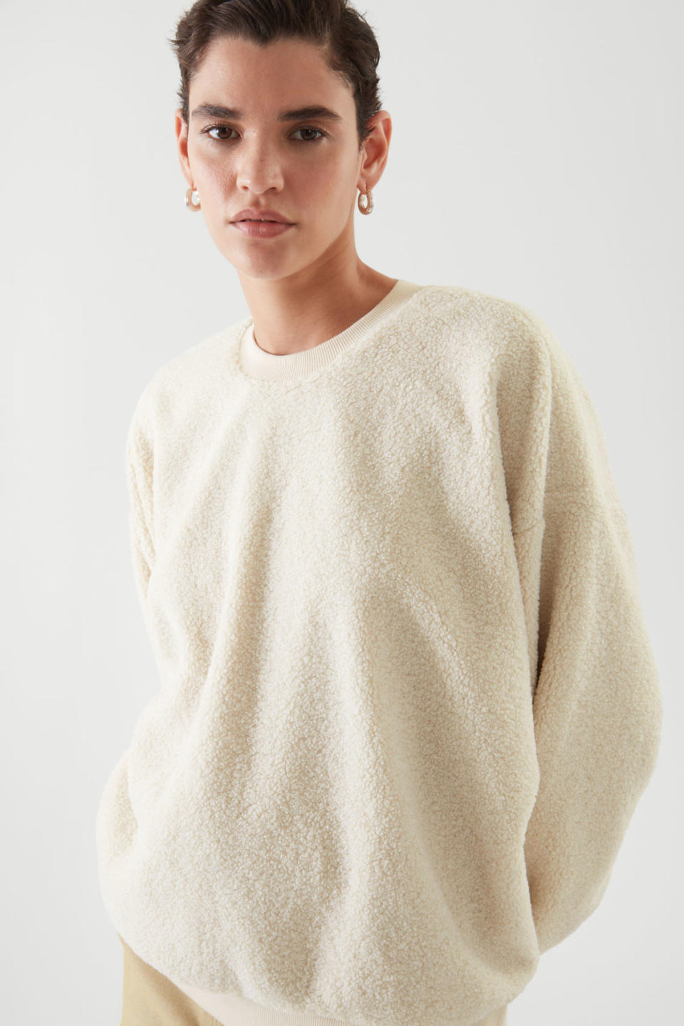 Model wears Oversized Teddy-Knit Sweater in cream