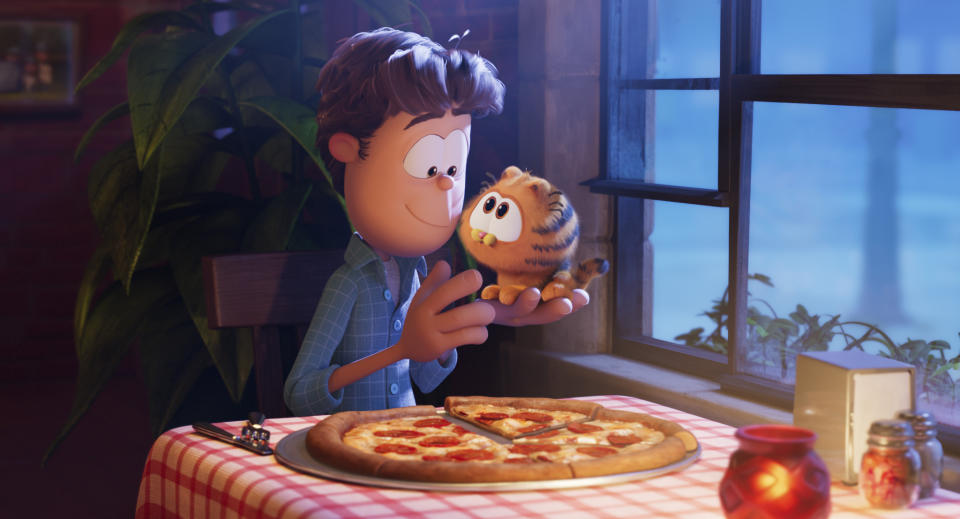 This image released by Sony Pictures shows characters Jon, voiced by Nicholas Hoult, left, and Garfield, voiced by Chris Pratt, in a scene from the animated film "The Garfield Movie." (Columbia Pictures/Sony via AP)