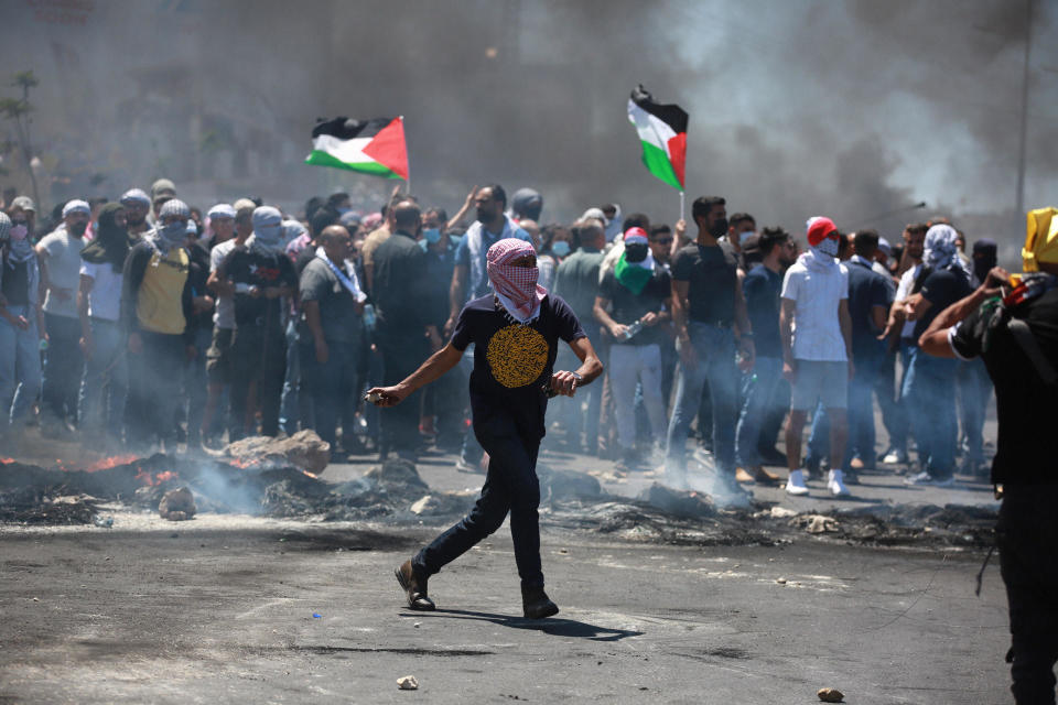 Palestinians protest ongoing Israeli attacks on the Gaza Strip and actions in east Jerusalem, in Ramallah, West Bank, on May 18, 2021. / Credit: Issam Rimawi/Anadolu Agency via Getty Images