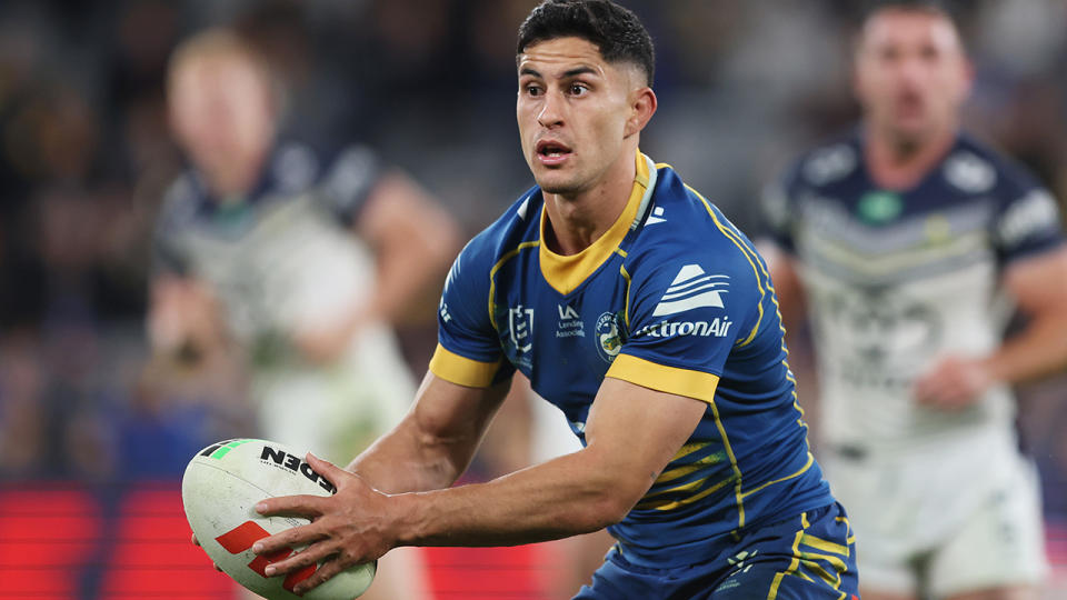 Dylan Brown carries the ball for Parramatta in an NRL match.