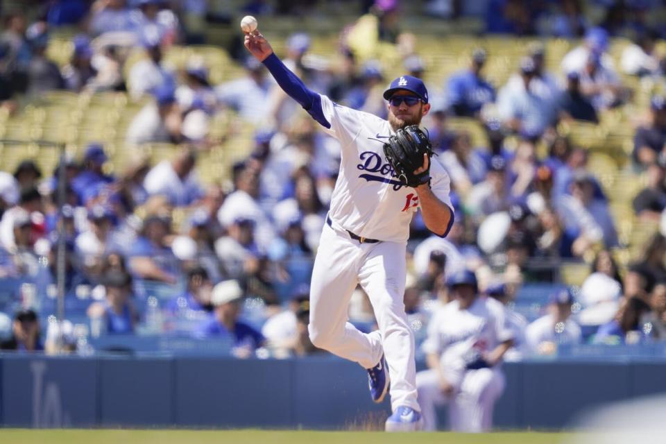 Dodgers third baseman Max Muncy throws to first during a game against the Nationals last month at Dodger Stadium.