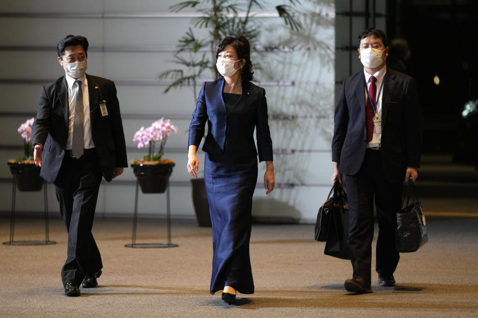 Seiko Noda, center, newly appointed Minister of State for Measures for Declining Birthrate arrives at the prime minister's official residence Monday, Oct. 4, 2021, in Tokyo. Fumio Kishida has been elected Japan's prime minister in a parliamentary vote and will be tasked with quickly tackling the pandemic and other challenges and leading a national election within weeks. (AP Photo/Shuji Kajiyama)
