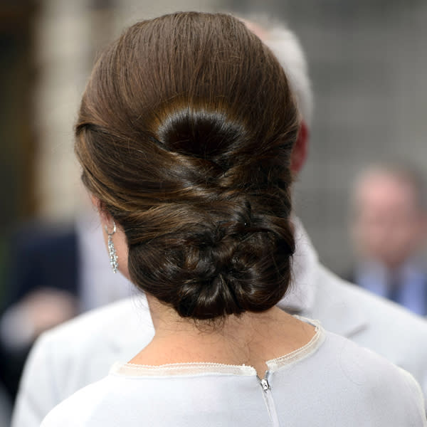 Kate Middleton Top 10 Best Hairstyles: Kate kept her hair off a face and in a tidy bun-style for a Royal Academy of the Arts gala in July ©Rex