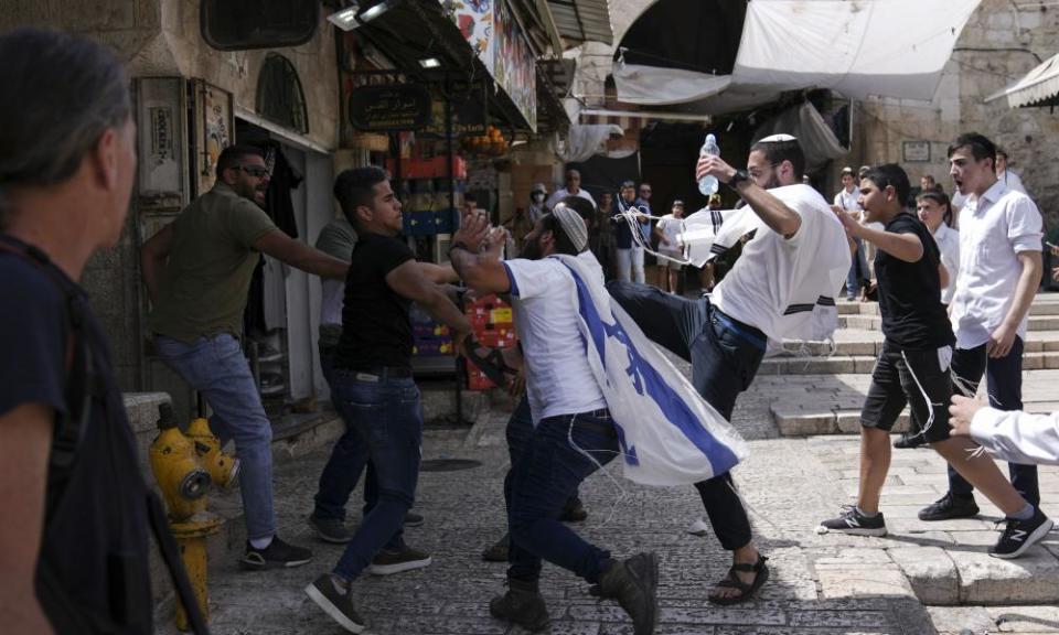 Palestinians and Jewish youths clash in Jerusalem’s Old City as Israelis mark Jerusalem Day.