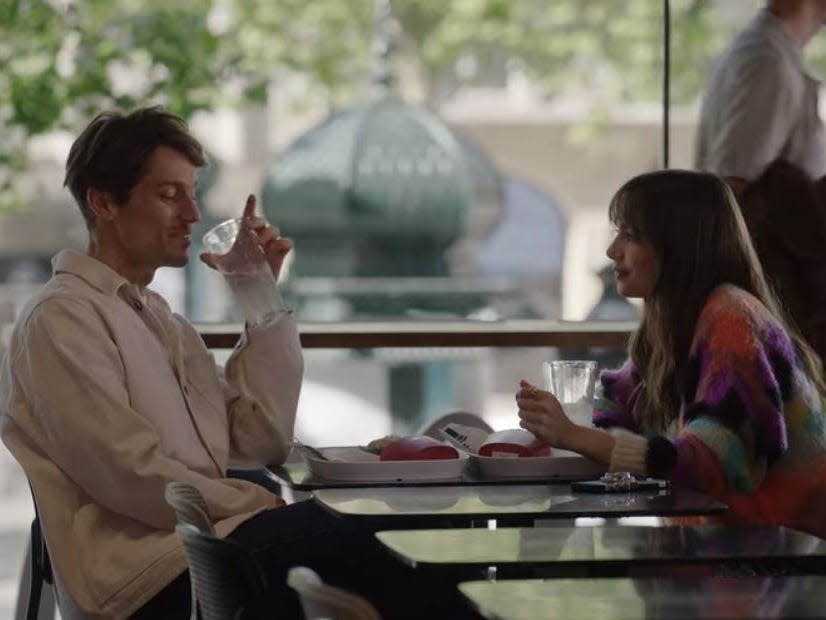 gabriel and emily at a paris mcdonalds on emily in paris season three episode one