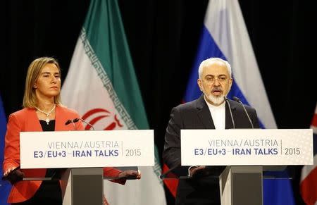 Iranian Foreign Minister Mohammad Javad Zarif addresses during a joint news conference with High Representative of the European Union for Foreign Affairs and Security Policy Federica Mogherini (L) after a plenary session at the United Nations building in Vienna, Austria July 14, 2015. REUTERS/Leonhard Foeger