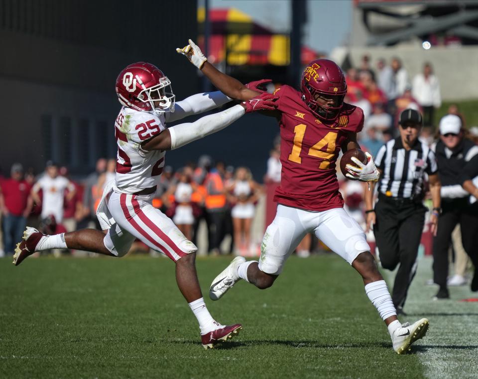 Iowa State wide receiver Dimitri Stanley (14) outruns Oklahoma defensive back Justin Broiles (25) in the fourth quarter at Jack Trice Stadium on Oct. 29.