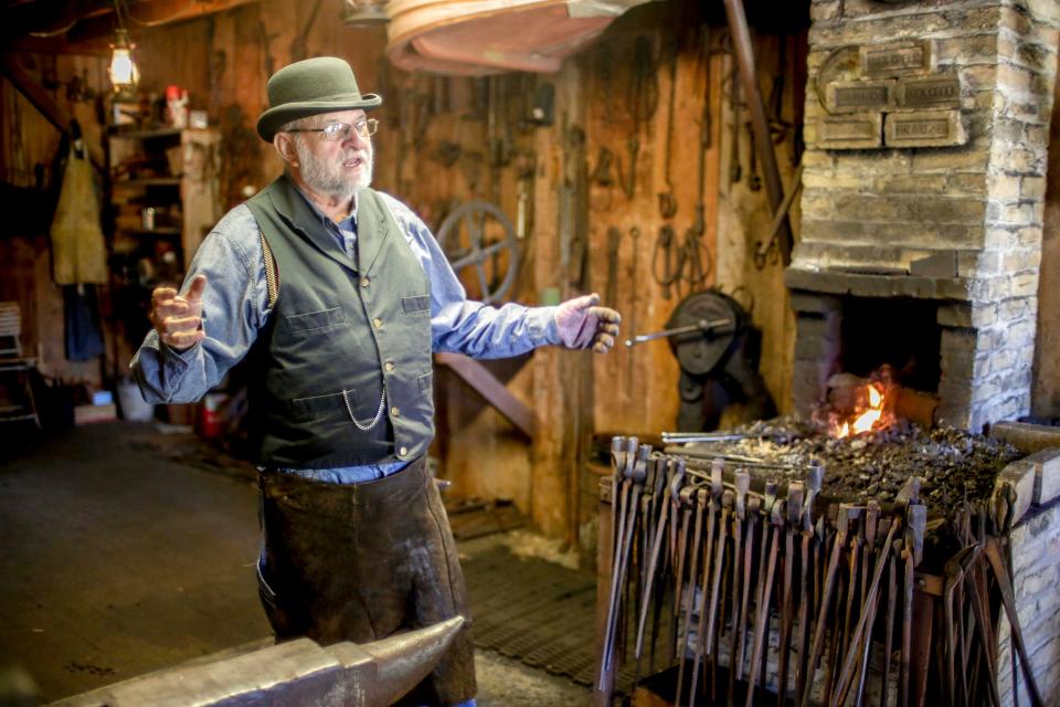 Blacksmith George Baldwin explains the craft of blacksmithing at Pinecrest Historical Village, Saturday, August 14, 2021, in Manitowoc, Wis.
