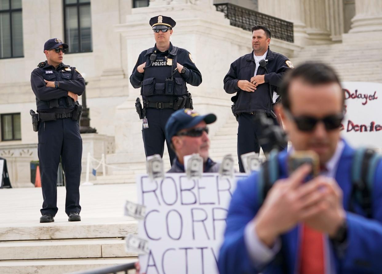 Protestors gather outside of the US Supreme Court on April 25, 2024 as the Supreme Court justices hear oral arguments on whether former President Donald Trump is immune from criminal charges in his federal election interference case in Washington, DC.