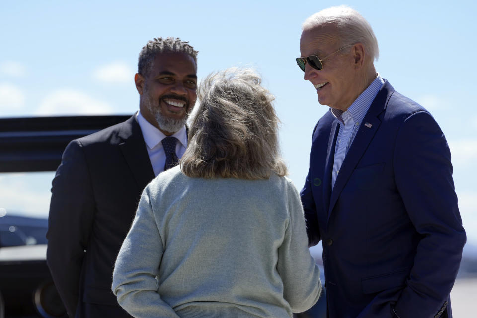 President Joe Biden greets Rep. Dina Titus, D-Nev., and Rep. Steve Horsford, D-Nev., as he arrives on Air Force One at Harry Reid International Airport, Tuesday March 19, 2024, in Las Vegas, for campaign events. (AP Photo/Jacquelyn Martin)