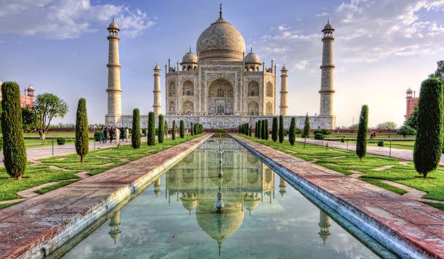 ? RAZVAN CIUCA / Getty Images The famous Taj Mahal, a white marble mausoleum located in Agra. This image was captured at sunrise when the gentle sun enhanced the white marble with warm color tones.