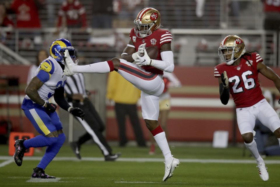 San Francisco 49ers free safety Jimmie Ward intercepts a pass in the first quarter against the Rams.