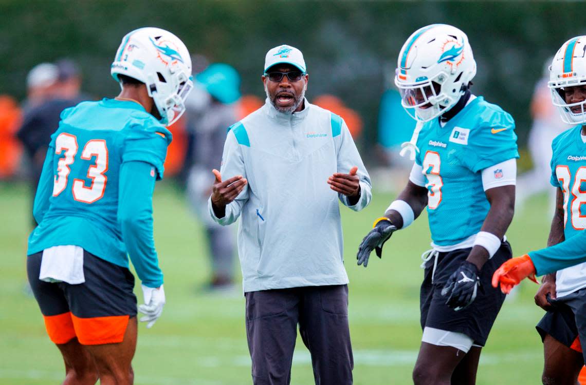 Miami Dolphins cornerbacks coach and pass game specialist Sam Madison talks to his players during the NFL football team’s organized team activities at Baptist Health Training Complex in Hard Rock Stadium on Tuesday, May 24, 2022 in Miami Gardens, Florida, in preparation for their 2022-23 NFL season.