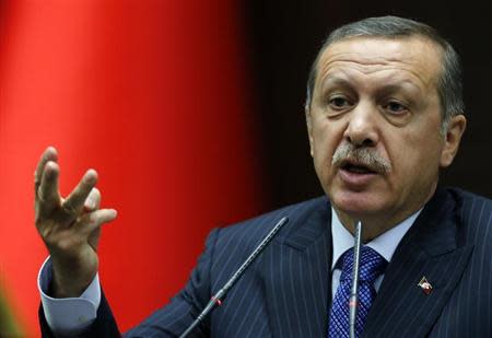 Turkey's Prime Minister Tayyip Erdogan addresses members of parliament from his ruling AK Party (AKP) during a meeting at the Turkish parliament in Ankara November 26, 2013. REUTERS/Umit Bektas