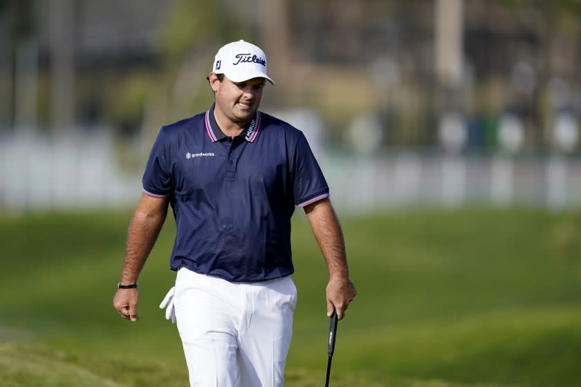 Patrick Reed reacts after missing a putt on the ninth hole of the North Course during the first round of the Farmers Insurance Open golf tournament at Torrey Pines on Thursday, Jan. 28, 2021, in San Diego. (AP Photo/Gregory Bull)