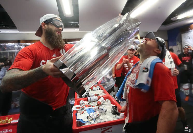 TORONTO, ON - SEPTEMBER 29: Brent Burns #88 pours some beer from the cup for Brad Marchand #63 of Team Canada during Game Two of the World Cup of Hockey final series between Team Canada and Team Europe at the Air Canada Centre on September 29, 2016 in Toronto, Ontario, Canada. (Photo by Andre Ringuette/World Cup of Hockey via Getty Images)