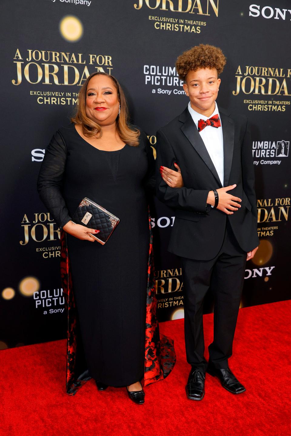 Dana Canedy and her son, Jordan, attend the "A Journal for Jordan" premiere in New York. Jordan wore his dad's dress shoes for the occasion.