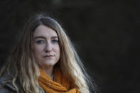 Jo Goodman poses for a portrait in London, Friday, Jan. 22, 2021. Jo's father Stuart died of COVID-19, in April 2020. A couple of months after her father died, Goodman, 32, co-founded the COVID-19 Bereaved Families for Justice group to pressure the government to back a public inquiry into how the pandemic was handled last spring. (AP Photo/Alastair Grant)