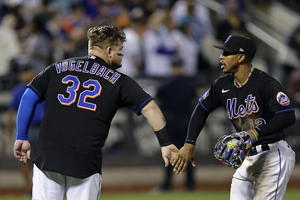 New York Mets designated hitter Daniel Vogelbach (32) and Francisco Lindor celebrate after they defeated the Seattle Mariners in a baseball game Friday, Sept. 1, 2023, in New York. (AP Photo/Adam Hunger)