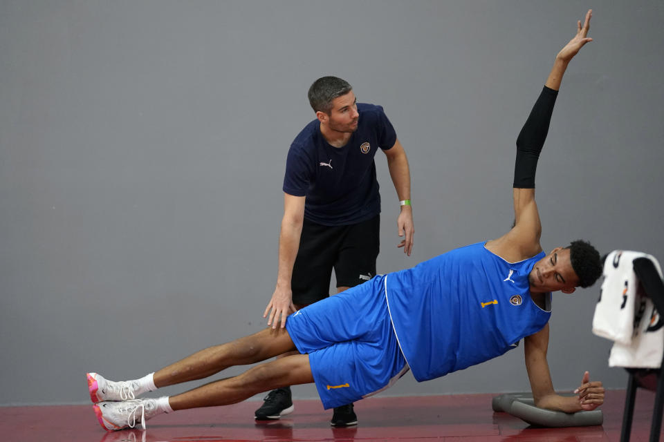 Boulogne-Levallois Metropolitans 92's Victor Wembanyama, right, works with a trainer during a team practice Monday, Oct. 3, 2022, in Las Vegas. (AP Photo/Abbie Parr)