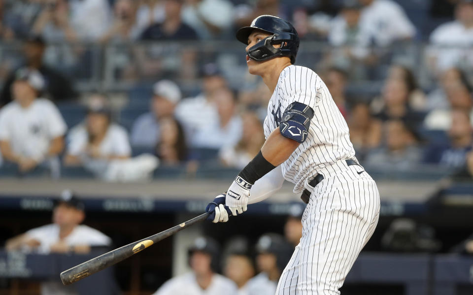 MLB star Aaron Judge #99 of the New York Yankees follows through on his second inning of two run home run 