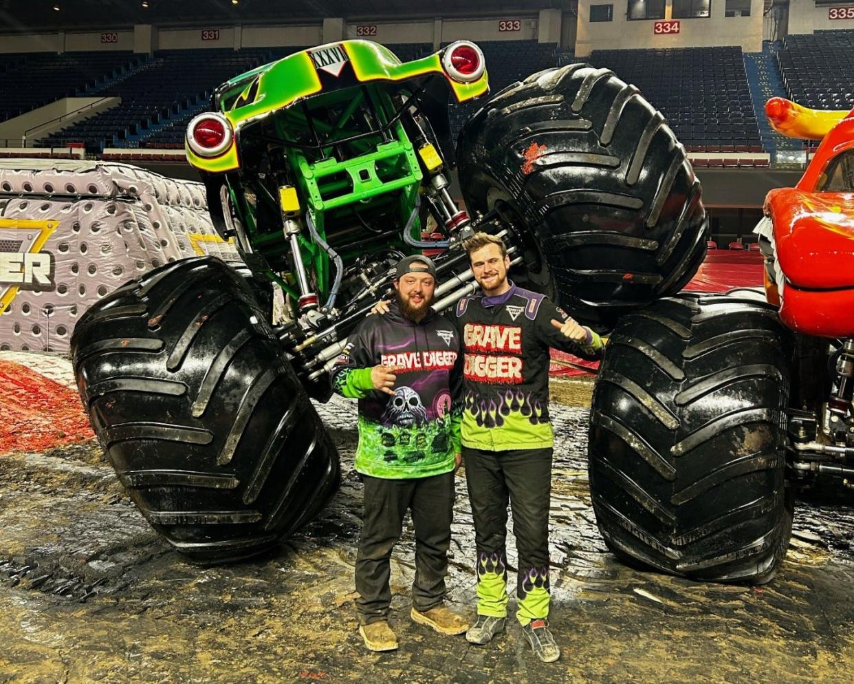Jefferson graduate Chandler West and driver Westin Anderson stands in front of Grave Digger. West is the crew chief for the monster truck that will compete in the upcoming Monster Jam.