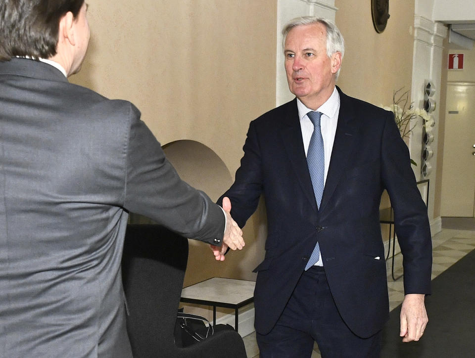 Sweden's Speaker of Parliament Andeas Norlen, left, welcomes European Union chief Brexit negotiator Michel Barnier during a visit to the Swedish Parliament in Stockholm, Thursday April 4, 2019. (Claudio Bresciani/TT via AP)