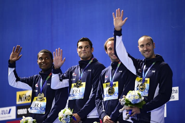 From left: France's Mehdy Metella, Florent Manaudou, Fabien Gilot and Jeremy Stravius celebrate during the podium ceremony of the men's 4x100m freestyle relay swimming event at the 2015 FINA World Championships in Kazan on August 2, 2015