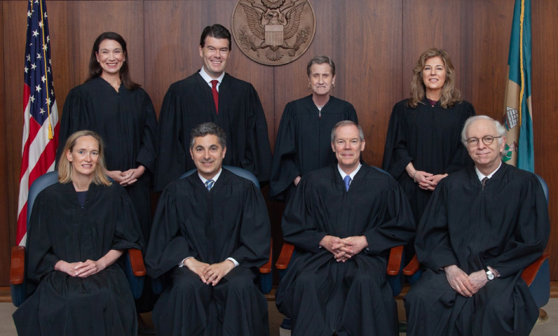 U.S. District Court Judge Maryellen Noreika (seated left, front row) with magistrates and judges of Delaware's District Court.