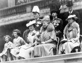 <p>Queen Elizabeth, King George VI, Queen Mary (center) and Princesses Elizabeth and Margaret observe the presentation of new colors to Grenadier Guards at Buckingham Palace. </p>