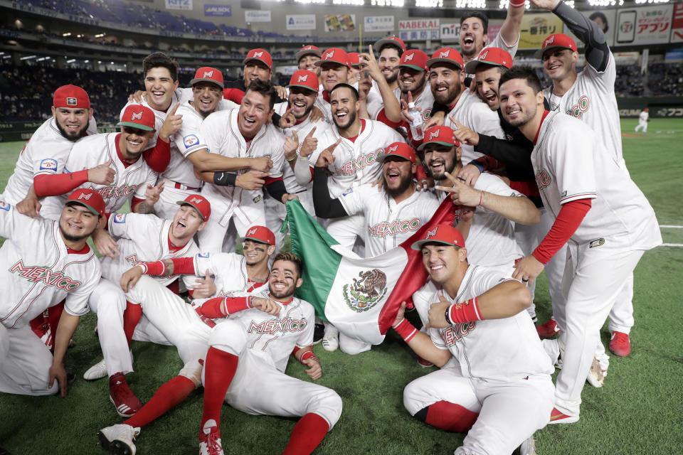 TOKYO, JAPAN - NOVEMBER 17: Mexico players celebrate their victory and qualification for the Tokyo 2020 Olympic Games after the WBSC Premier 12 Bronze Medal final game between Mexico and USA at the Tokyo Dome on November 17, 2019 in Tokyo, Japan. (Photo by Kiyoshi Ota/Getty Images)