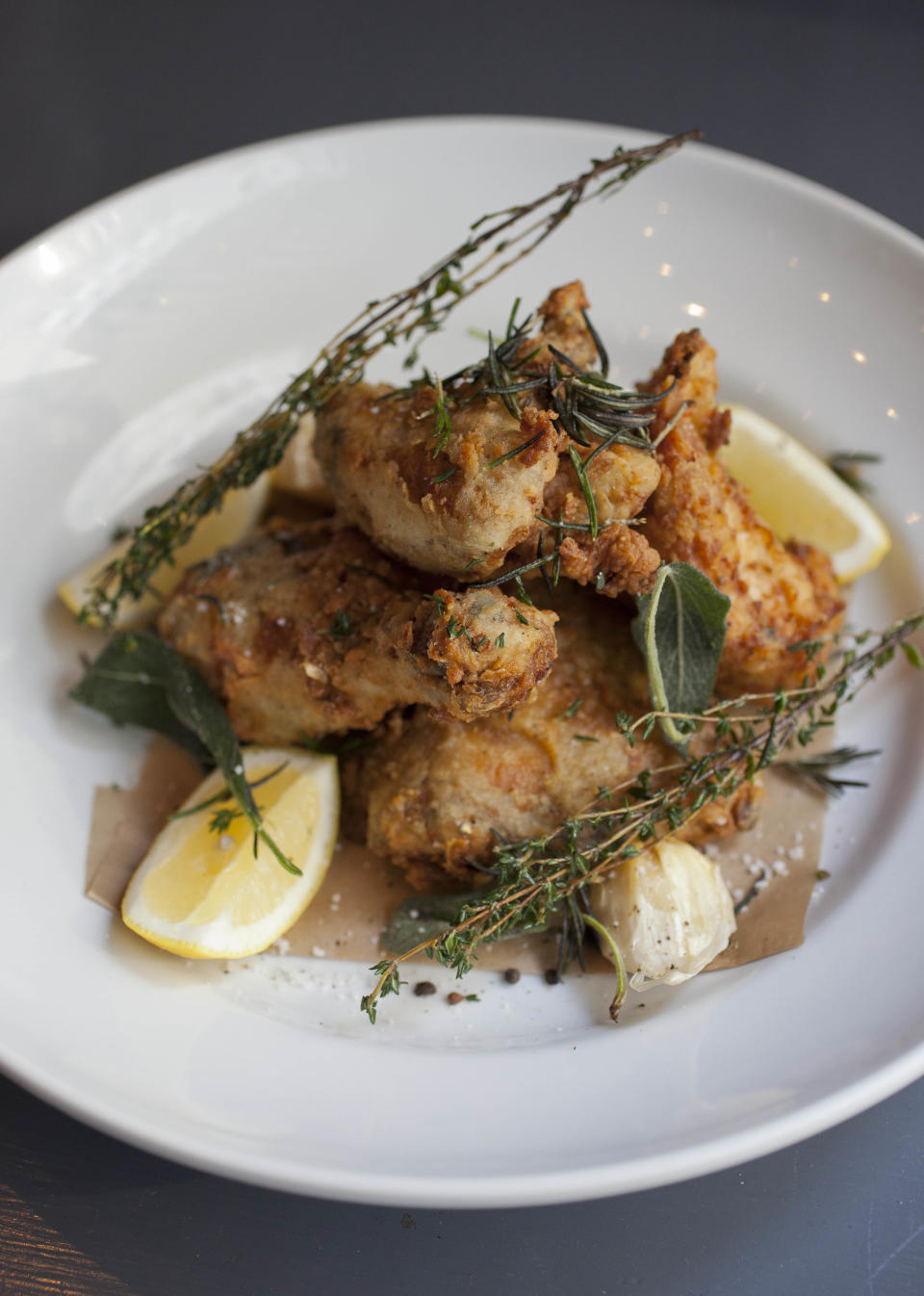 In this photo taken Monday, Oct. 29, 2012, chef Tyler Florence's fried chicken dish at his Wayfare Tavern in San Francisco. Baby food and fried chicken may well be the legacy for which Tyler Florence ultimately is best known. Which seems a bit crazy given his near ubiquity on the Food Network since its earliest days on air, his years of running the celebrity chef gauntlet, his many cookbooks, product lines and appearances. (AP Photo/Eric Risberg)