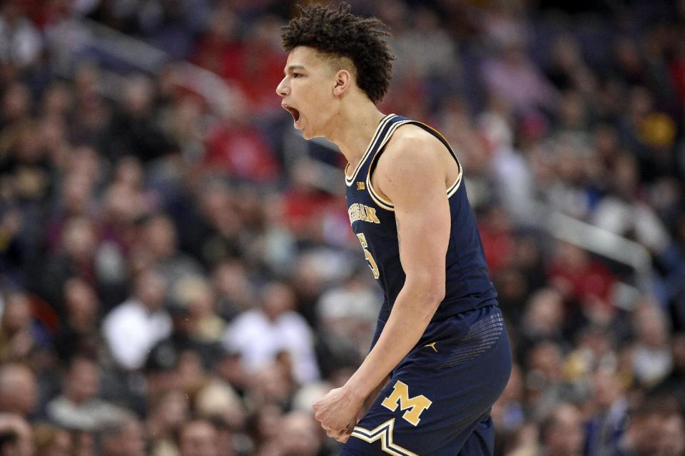 Michigan forward D.J. Wilson reacts during the first half of an NCAA college basketball game against Purdue in the Big Ten tournament, Friday, March 10, 2017, in Washington. (AP Photo/Nick Wass)