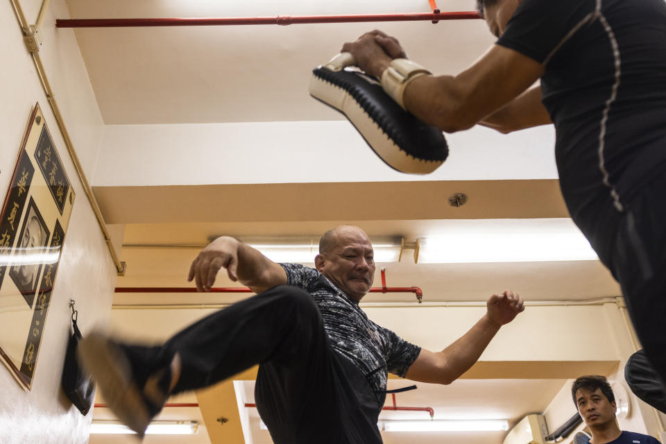 A practitioner trains during a Jeet Kune Do class in Hong Kong, Wednesday, July 19, 2023. (AP Photo/Louise Delmotte)