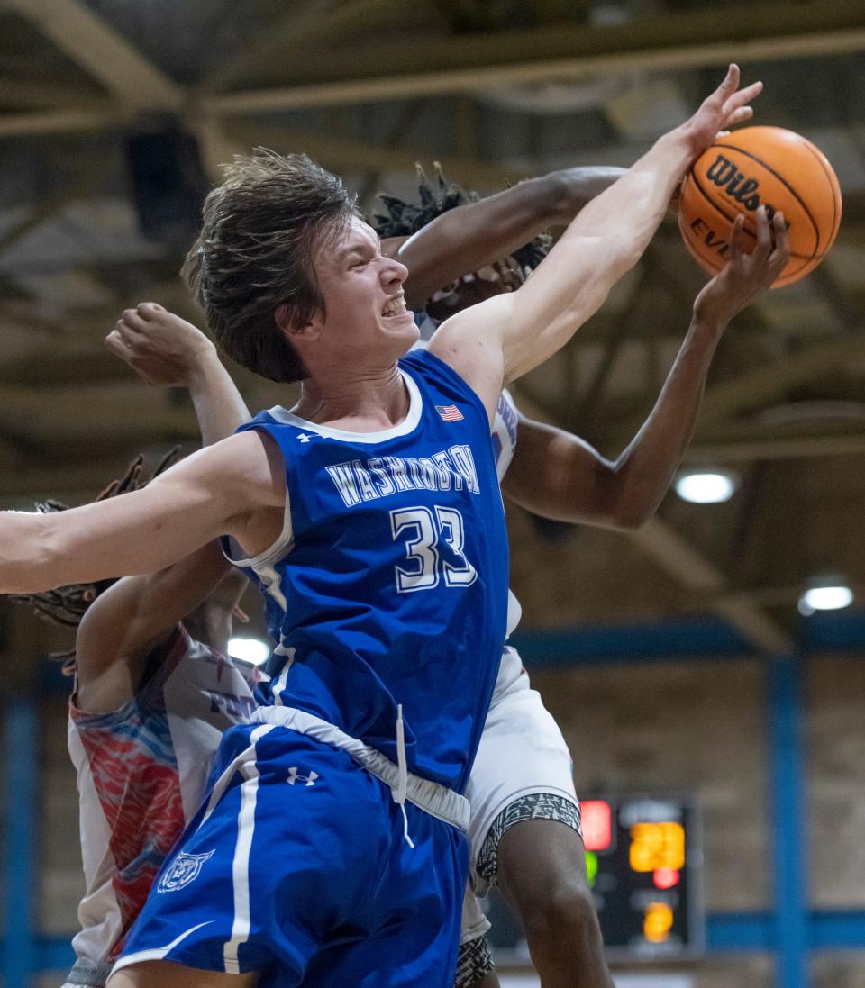 Tyler White (33) blocks a shot during the Booker T. Washington vs Pine Forest boys basketball game at Pine Forest High School in Pensacola on Friday, Jan. 7, 2022.