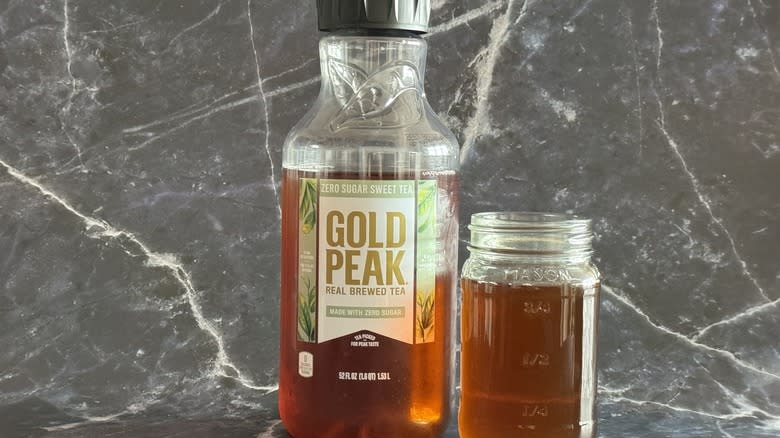 Gold Peak tea bottle and glass