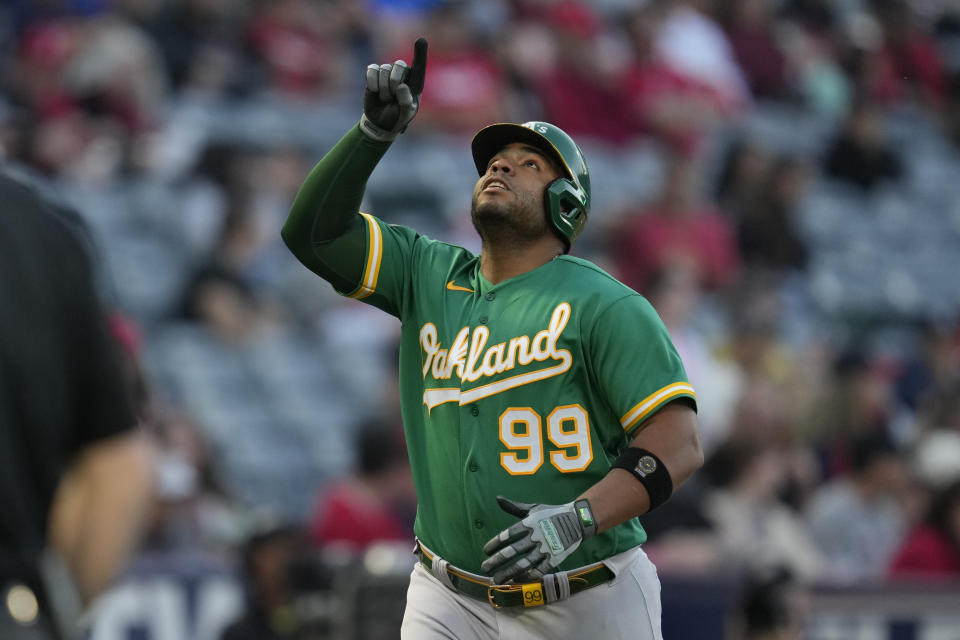 Oakland Athletics' Jesus Aguilar (99) celebrates after hitting a home run during the first inning of a baseball game against the Los Angeles Angels in Anaheim, Calif., Monday, April 24, 2023. (AP Photo/Ashley Landis)