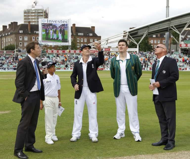 England's captain Andrew Strauss (3rd L) performs the coin toss ahead of a Test match against South Africa, at the Oval in London, in 2012