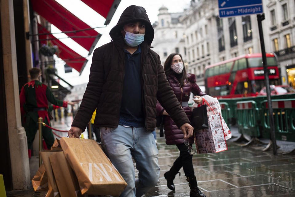 Shoppers wearing face masks in Regent Street, London, after the second national lockdown ended and England has a strengthened tiered system of coronavirus restrictions. (Photo by Victoria Jones/PA Images via Getty Images)