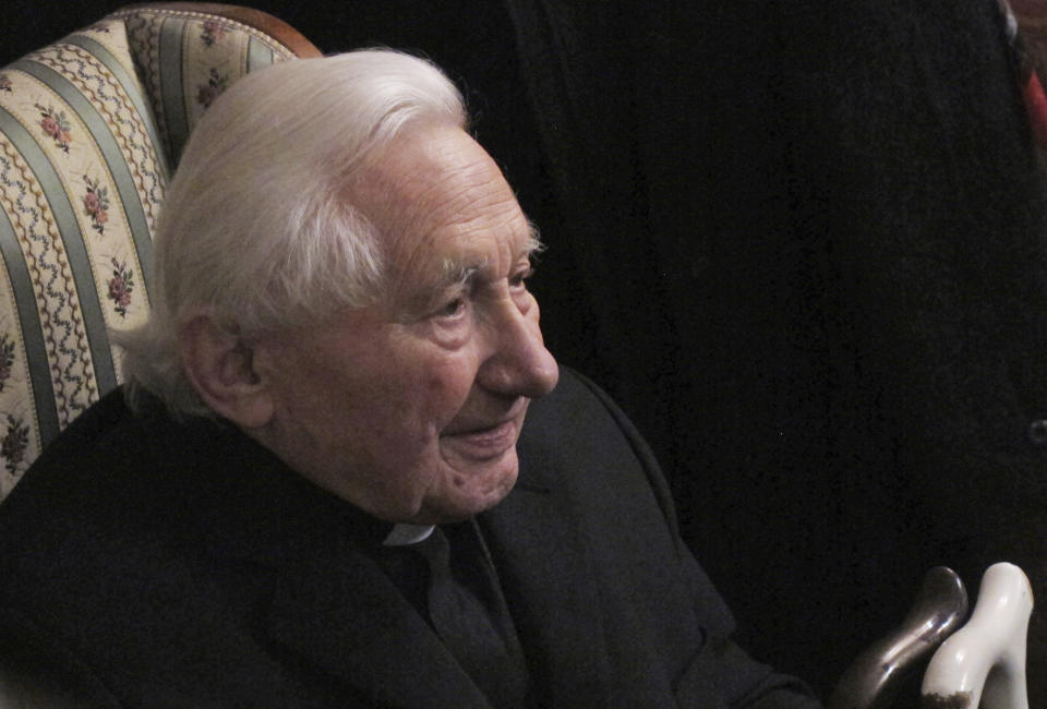 FILE - In this Tuesday, Feb 12, 2013 file photo, Georg Ratzinger answers journalists' questions during a media opportunity in his home in Regensburg, southern Germany. The Rev. Georg Ratzinger, the older brother of Emeritus Pope Benedict XVI, who earned renown in his own right as a director of an acclaimed German boys’ choir, has died at age 96. The Regensburg diocese in Bavaria, where Ratzinger lived, said in a statement on his website that he died on Wednesday, July 1, 2020. (AP Photo/Frank Jordans, File)