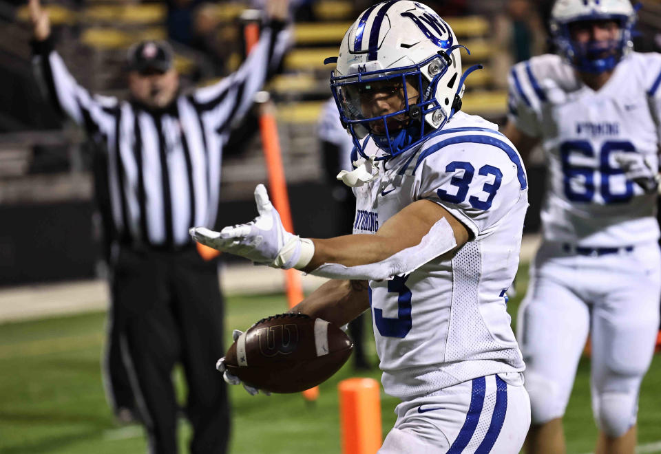 Wyoming running back C.J. Hester reacts after scoring a touchdown during the Cowboys' win over Steubenville in the state semifinals Saturday, Nov. 26 at Historic Crew Stadium in Columbus.