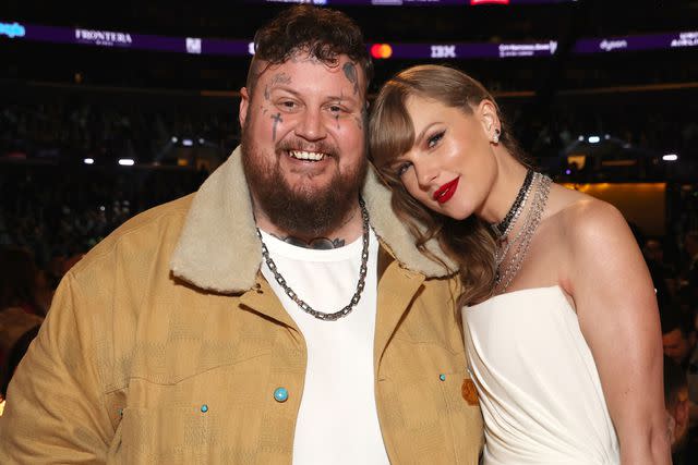 <p>Kevin Mazur/Getty</p> Jelly Roll and Taylor Swift at the Grammys in Los Angeles in February 2024