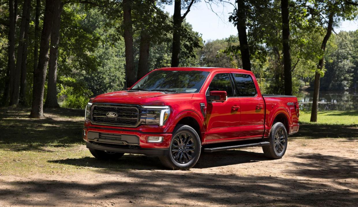 a red truck parked in a park