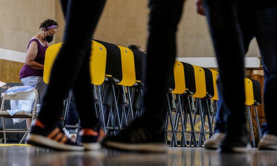 A voter casts a ballot for the California recall election at a polling station in Los Angeles.