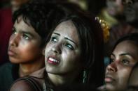 Brazil's fans react during a public viewing event at a street in Rio de Janeiro during the 2014 FIFA World Cup semifinal match between Brazil and Germany --being held at Mineirao Stadium in Belo Horizonte-- on July 8, 2014