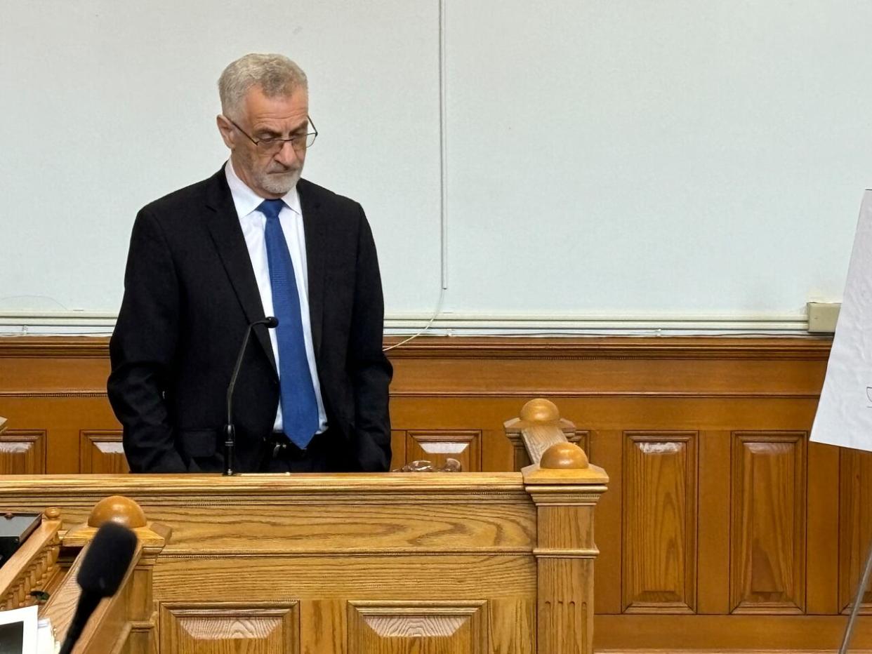 Robert Regular, 72, waits inside the witness box during a break in proceedings at Supreme Court in St. John's on Thursday morning.  (Ariana Kelland/CBC - image credit)