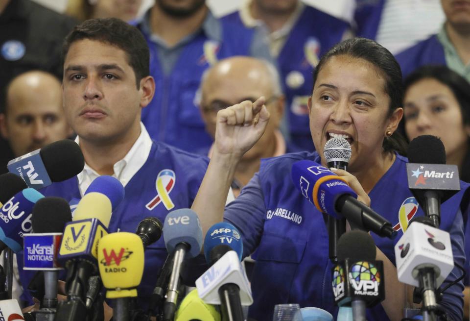 FILE - In this Feb. 21, 2019 file photo, Venezuelan exiled lawmaker Gaby Arellano speaks to the media during a press conference in Cucuta, Colombia. "Exile feels isolating, but we've been able to reinvent ourselves," said exiled lawmaker turned activist Arellano, who is playing a key role in collecting humanitarian aid. (AP Photo/Fernando Vergara, File)