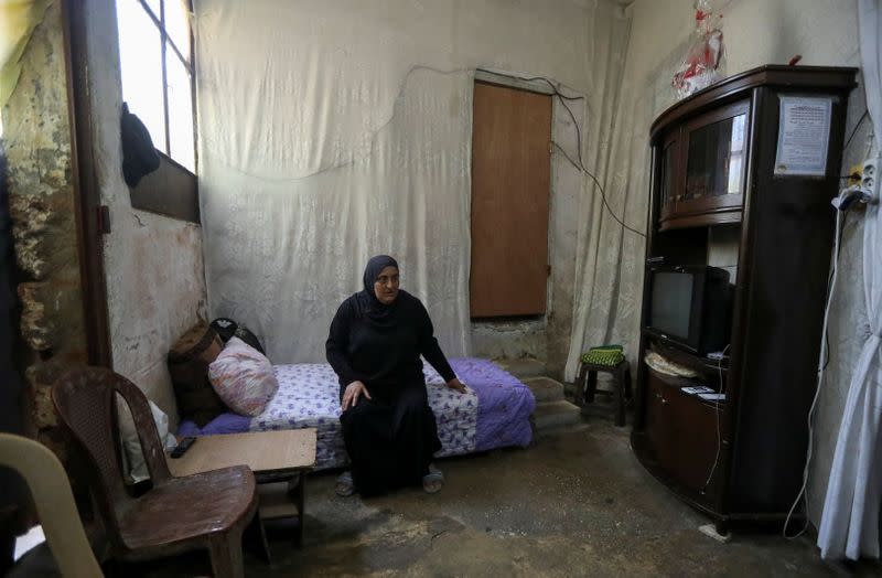 Mariam Khaled Maksoud sits inside her home in Tripoli